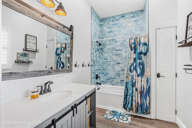 bathroom featuring vanity, wood-type flooring, and shower / tub combo