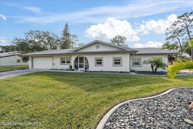 ranch-style house with a garage and a front lawn