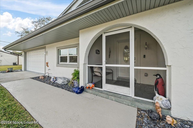 property entrance featuring a garage