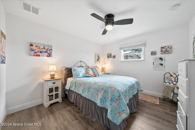 bedroom featuring ceiling fan and dark wood-type flooring