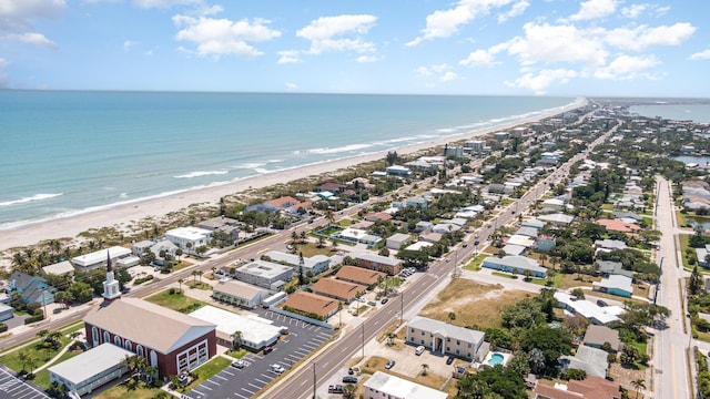 aerial view featuring a water view and a beach view