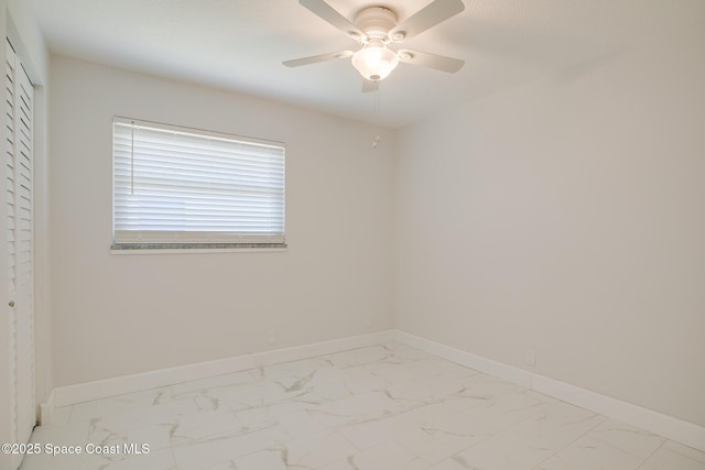 spare room with ceiling fan