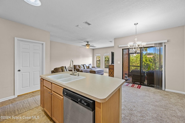 kitchen featuring a center island with sink, a textured ceiling, dishwasher, decorative light fixtures, and sink