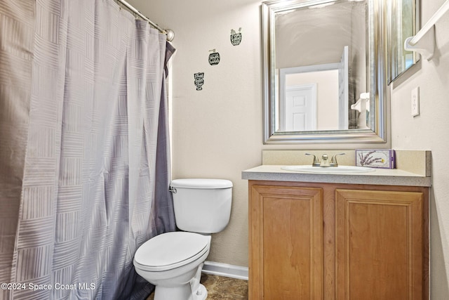 bathroom with vanity, toilet, and a shower with curtain