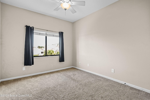 empty room featuring carpet and ceiling fan