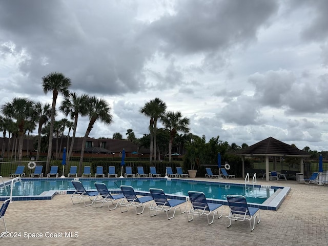 view of swimming pool with a patio