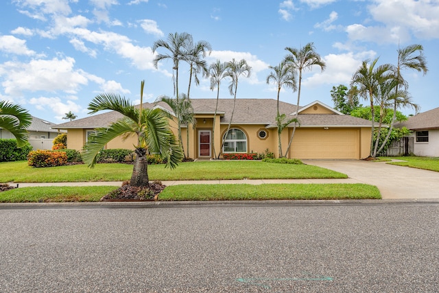 ranch-style home featuring a garage and a front yard