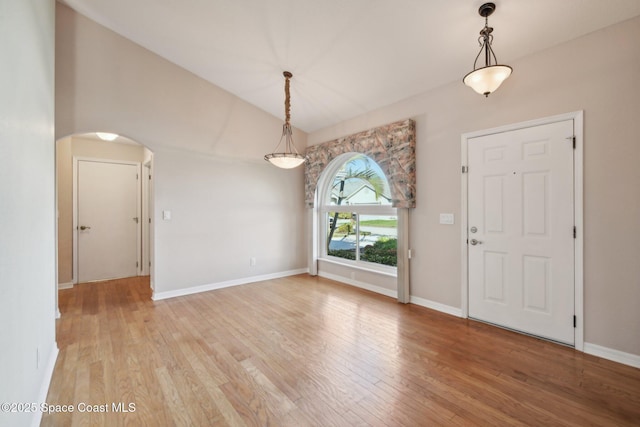 foyer featuring lofted ceiling and light hardwood / wood-style flooring