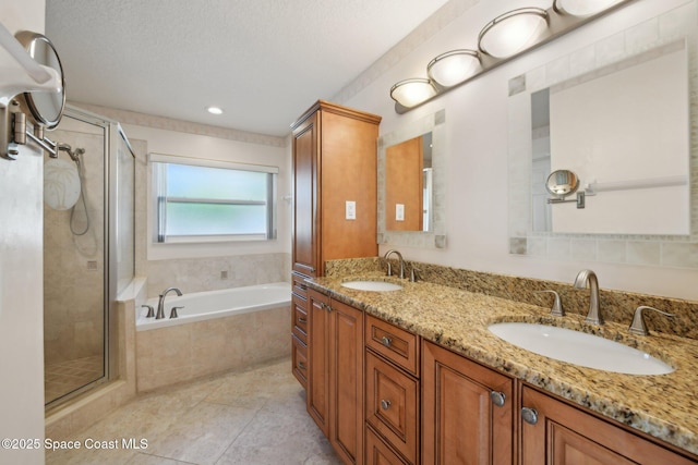 bathroom featuring plus walk in shower and vanity