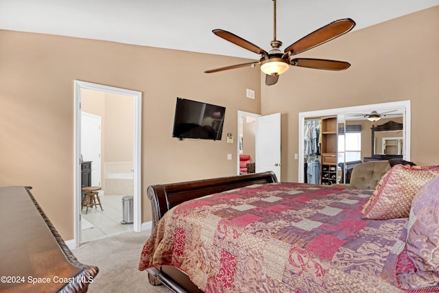 carpeted bedroom featuring connected bathroom and ceiling fan