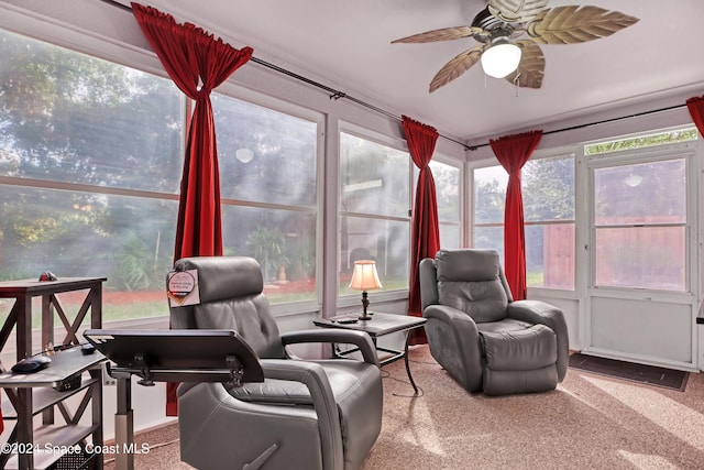 sunroom featuring ceiling fan