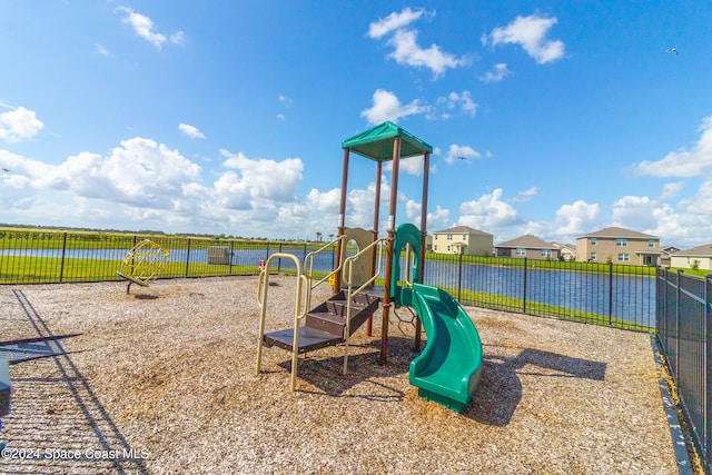 view of jungle gym with a water view