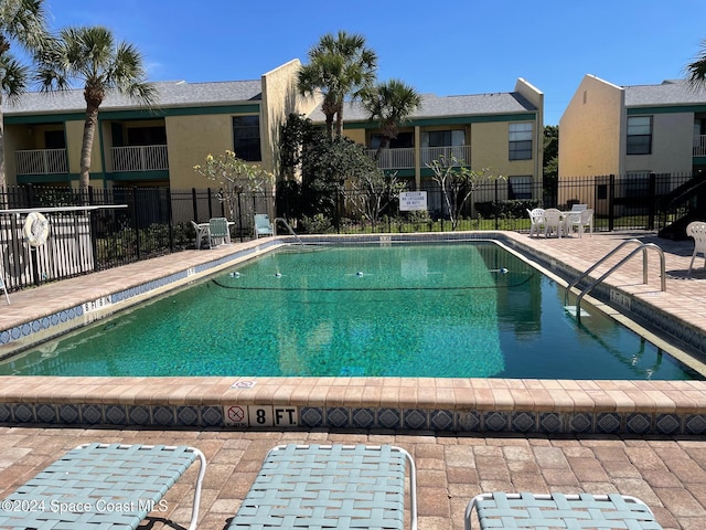 view of swimming pool featuring a patio