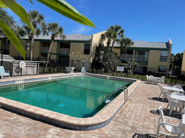 view of pool featuring a patio