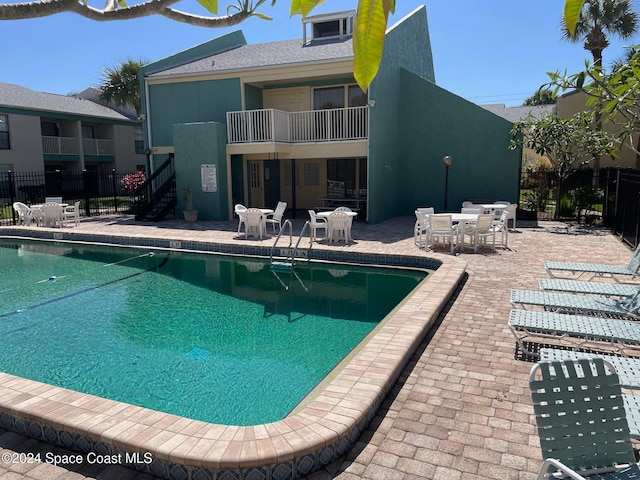 view of pool featuring a patio