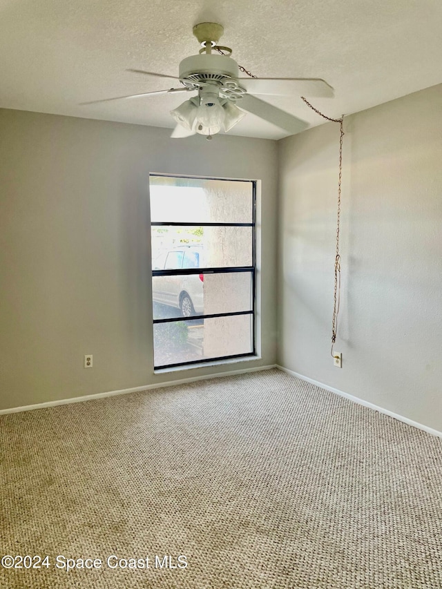 carpeted empty room with ceiling fan