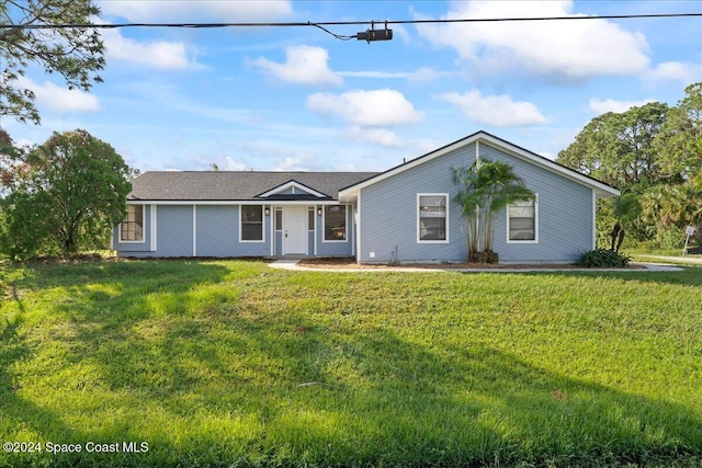 ranch-style home with a front yard