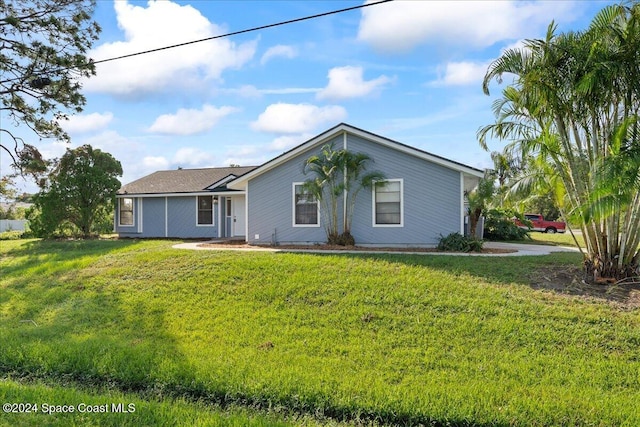 ranch-style home with a front yard