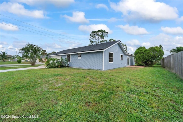 view of home's exterior featuring a lawn