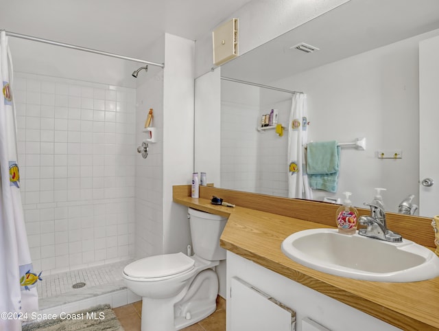 bathroom featuring vanity, curtained shower, toilet, and tile patterned floors