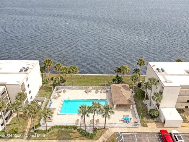 birds eye view of property with a water view