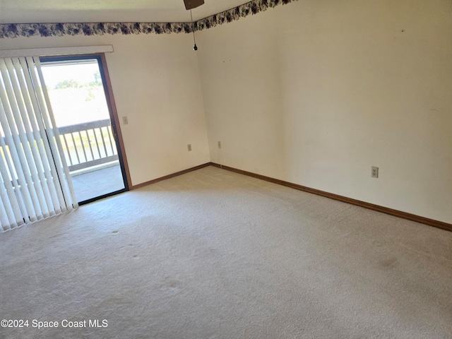 carpeted empty room with ceiling fan