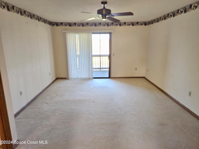 empty room with light carpet and ceiling fan