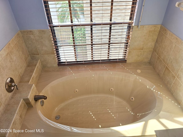 bathroom with tiled tub