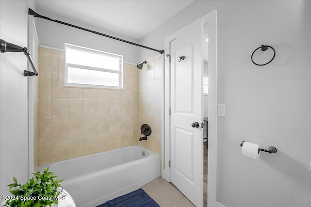 bathroom with tile patterned floors and tiled shower / bath