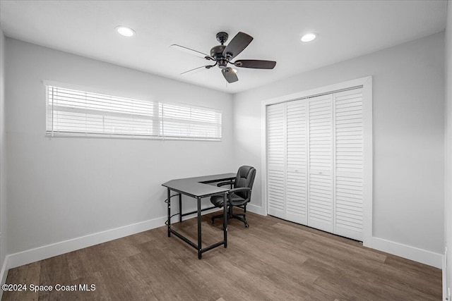 home office featuring hardwood / wood-style floors and ceiling fan