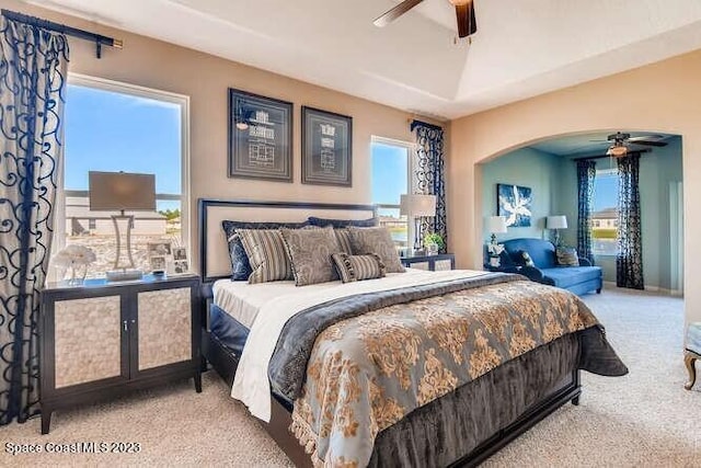 bedroom with multiple windows, carpet floors, and ceiling fan