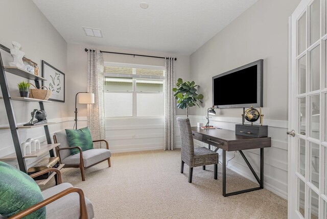 1366 Criswell Ln SE, Palm Bay, FL 32909 - office with light colored carpet, french doors, and wainscoting