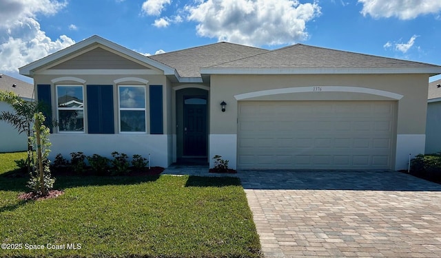 ranch-style house with a garage and a front lawn