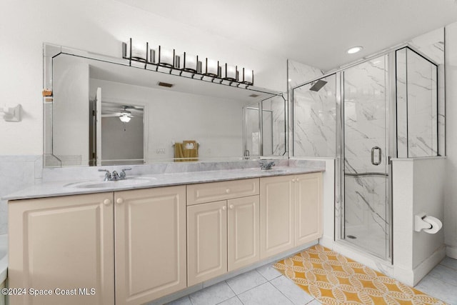 bathroom featuring a shower with door, ceiling fan, tile patterned flooring, and vanity