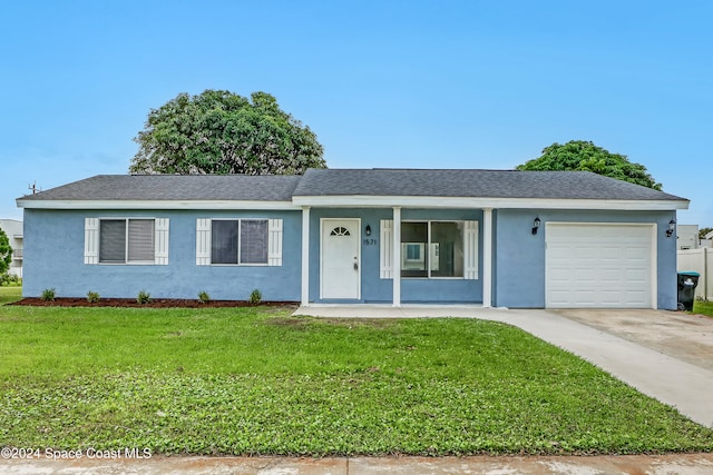 ranch-style home featuring a porch, a front lawn, and a garage