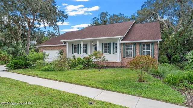 single story home featuring a front lawn