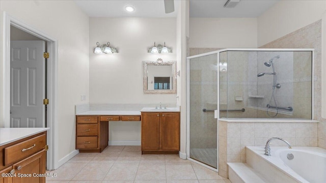 bathroom featuring vanity, separate shower and tub, and tile patterned floors