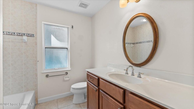 bathroom with vanity, toilet, and tile patterned floors