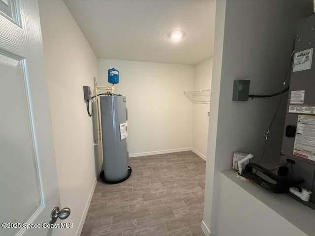 utility room featuring electric water heater