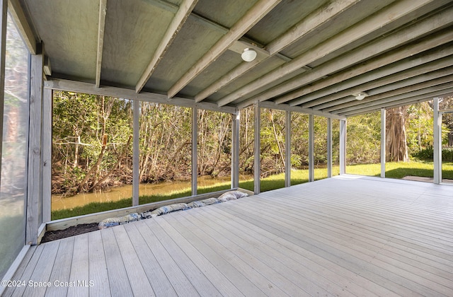 wooden deck featuring a water view