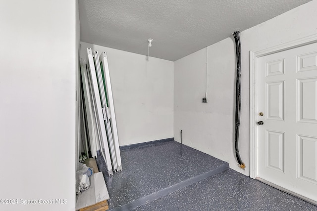 basement with a textured ceiling