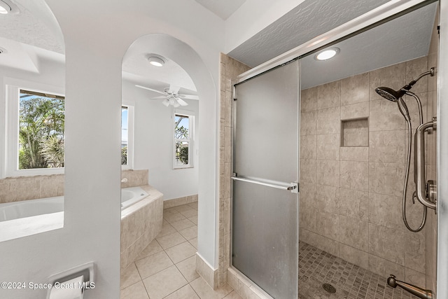 bathroom with plenty of natural light, tile patterned floors, and separate shower and tub