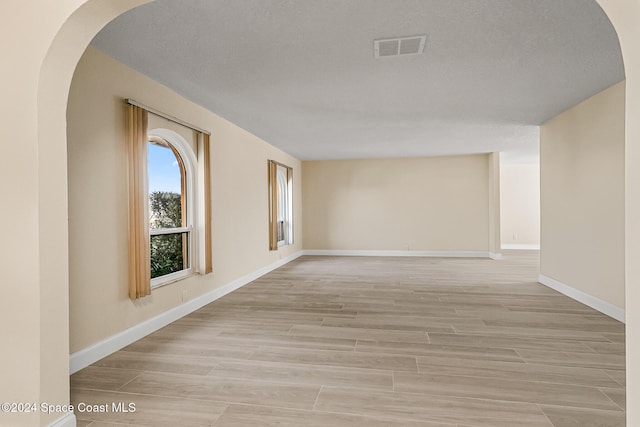 empty room with a textured ceiling