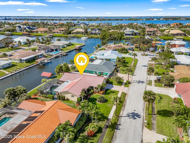 birds eye view of property featuring a water view