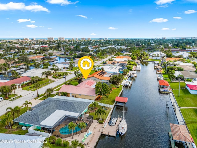 drone / aerial view featuring a water view