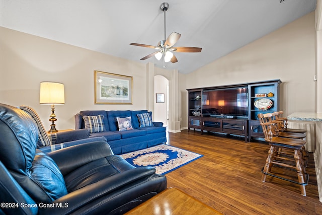 living room featuring lofted ceiling, dark hardwood / wood-style floors, and ceiling fan