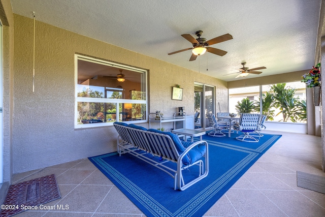 view of patio featuring ceiling fan