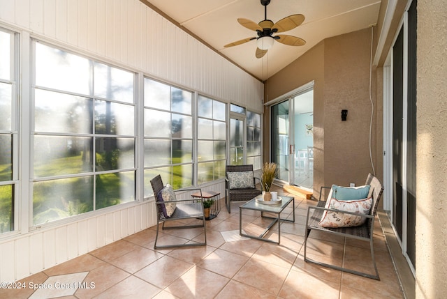 sunroom featuring plenty of natural light, ceiling fan, and vaulted ceiling