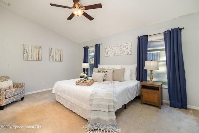 carpeted bedroom with ceiling fan and lofted ceiling