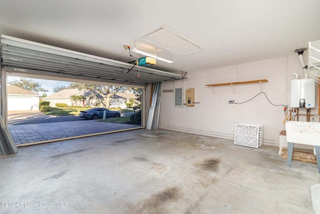 garage with electric panel, sink, tankless water heater, and a garage door opener